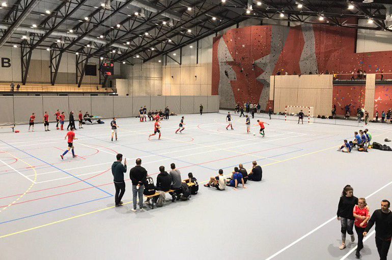 /><br />
</em><em>The new multipurpose complex at Oslofjord is impressive. Today it holds several thousand young people and various sports are being played side by side. Photo: BCC</em><em><br />
</em></p>
<p>On one wall, preparations are underway for climbing, with space dedicated to both beginners and more practiced climbers. Local groups from many countries are signed up, and older youth are guiding the younger ones.</p>
<p>Boys and girls are slowly inching their way up this impressive climbing wall, reaching over several stories high, with so-called boulder walls and climbing walls for beginners with thick mattresses on the floor below.</p>
<p><em><img decoding=