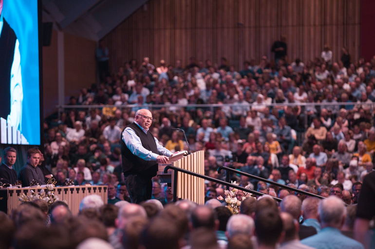 /><br />
<em>Kåre J. Smith speaks to the congregation on Friday evening. Photo:</em><em> BCC</em></p>
<p>Seven edifying gatherings will be held during the weekend, two of which are geared towards young people. The conference’s program also includes a live broadcast of the informational program “Brunstad Magazine”, and many activities for children. Children could register for seven different recreational and sports’ academies plus an optional soccer tournament for kids from six to ten years old.</p>
<p><img decoding=